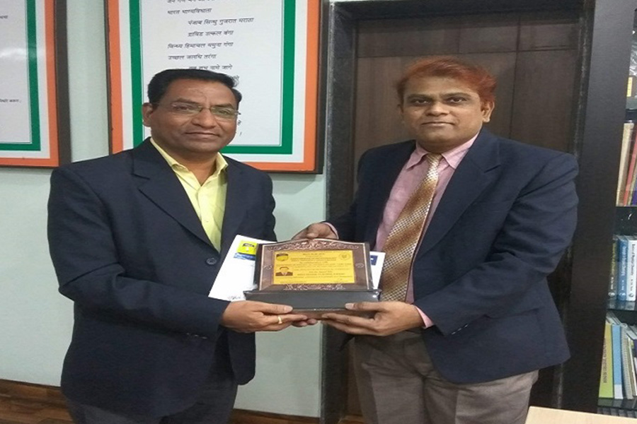 Felicitation of Prof. A.B. Pardeshi for getting best seniour Award by the Ospecous hands of Principal S.N.Thore